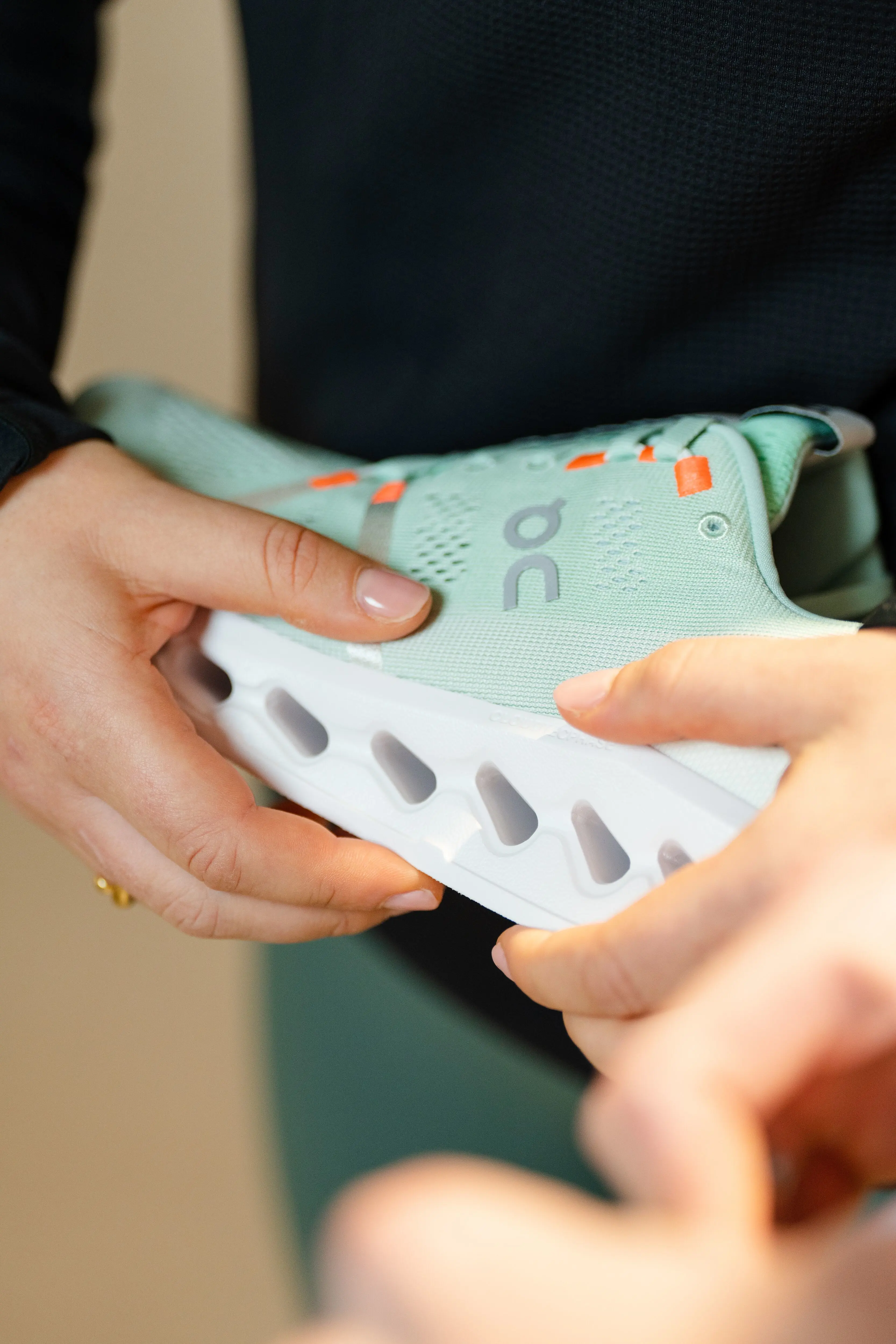 Person holding the new Cloudsurfer with a focus on the CloudTec Phase midsole.