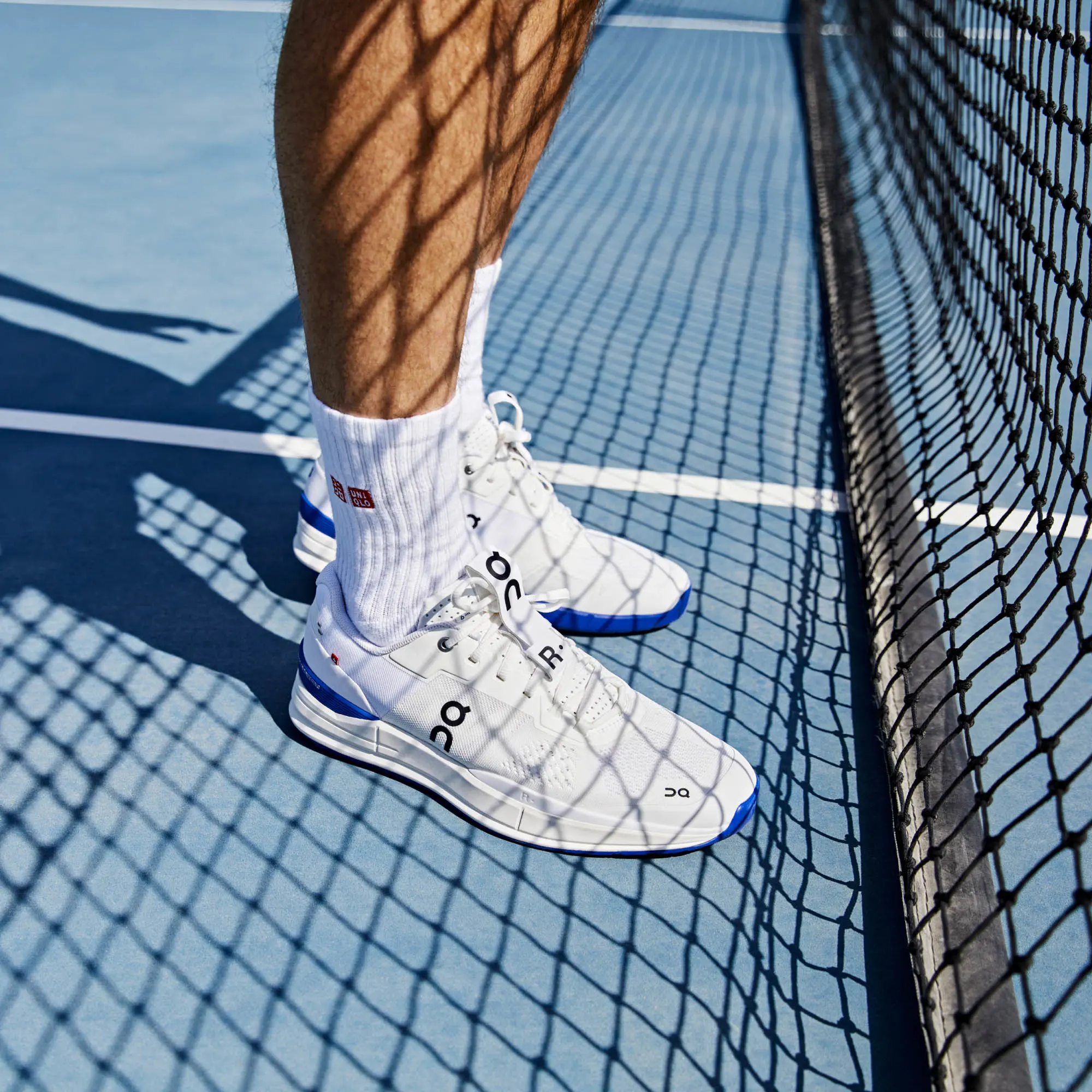 Knee-down view of Roger Federer wearing The Roger Pro on a hard court. 