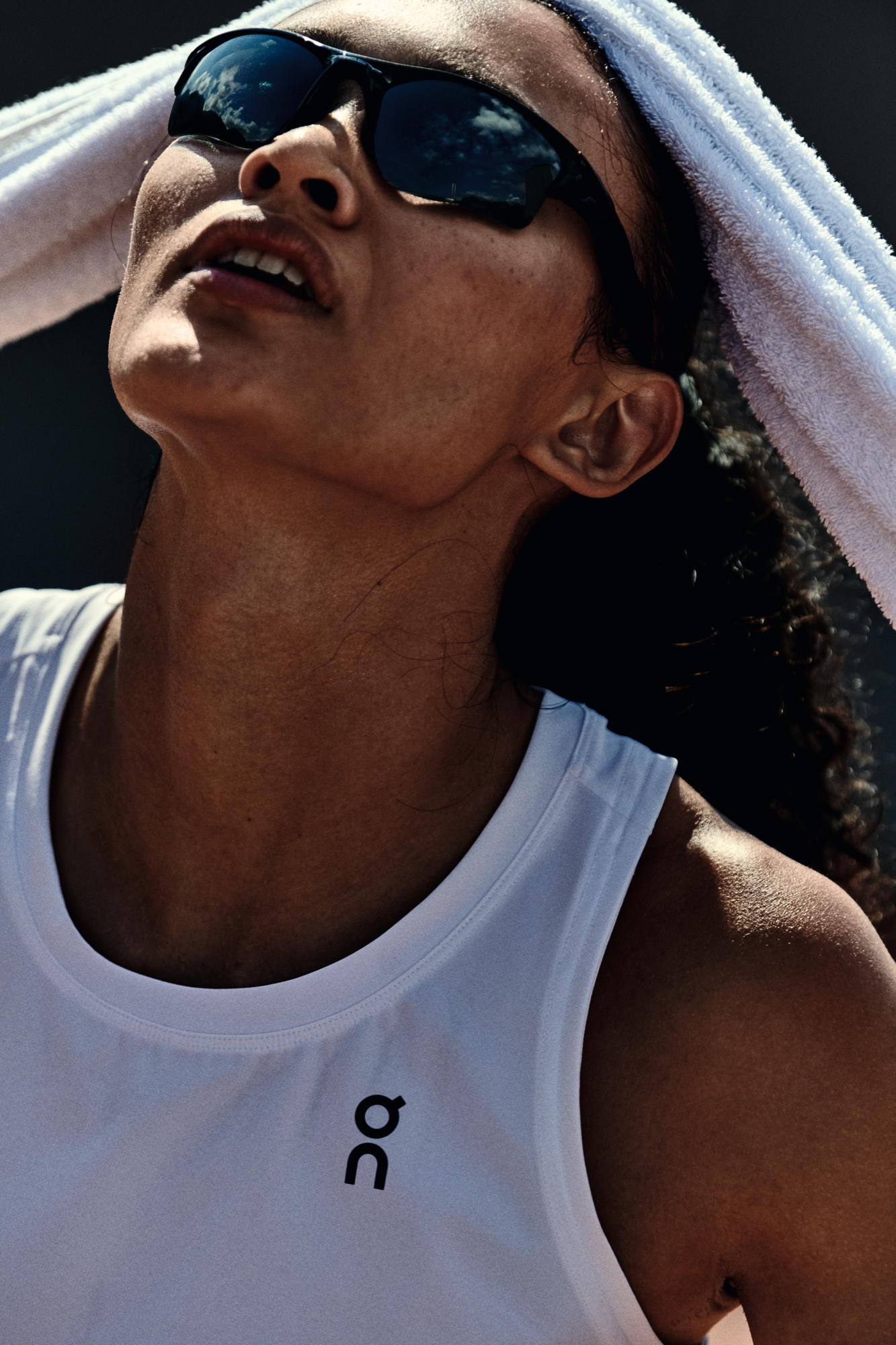 A tennis player takes a moment to practice her breathing exercise during a tough match.
