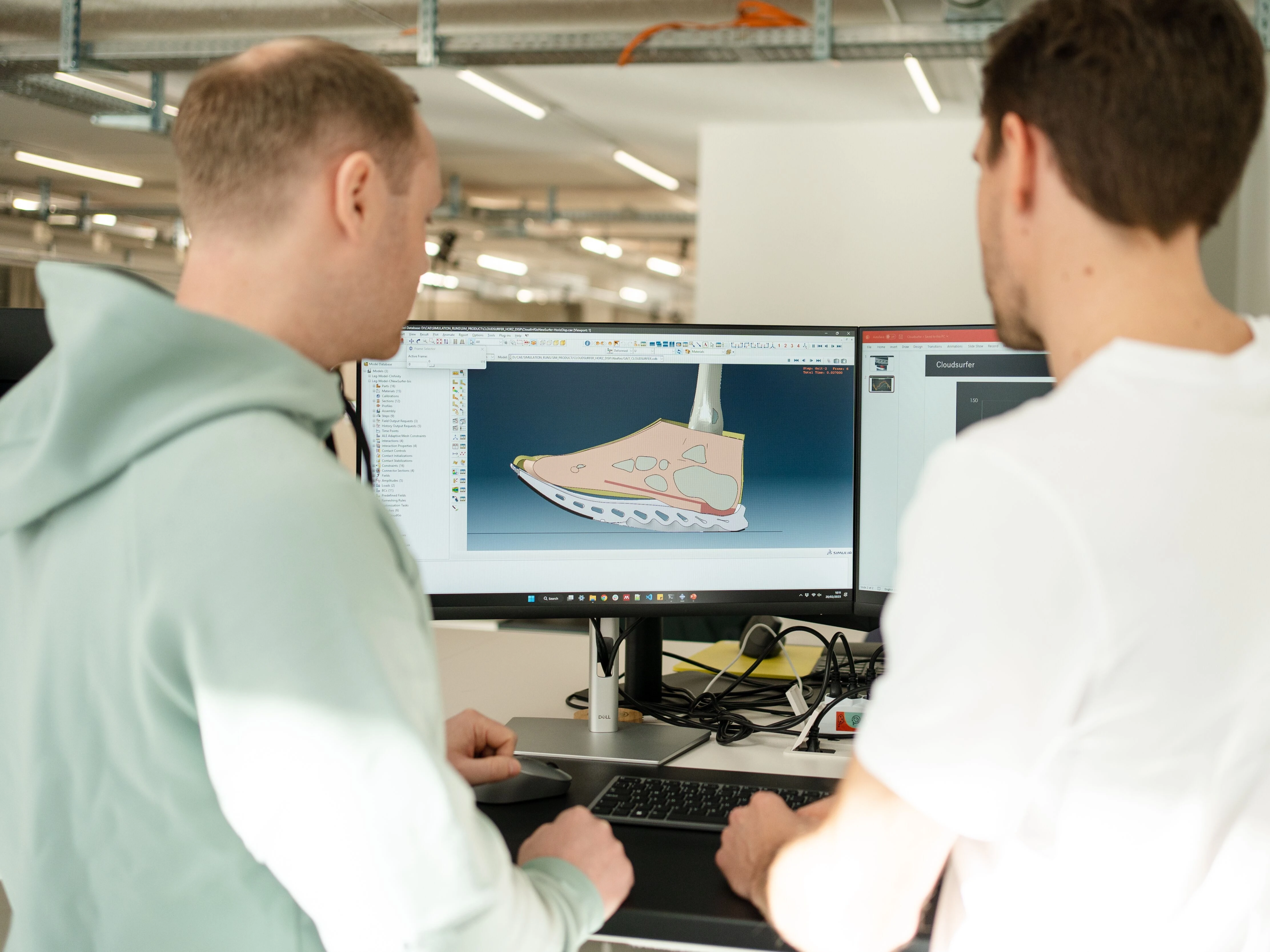 Two men looking at screen, which demonstrates Cloudtec Phase technology.
