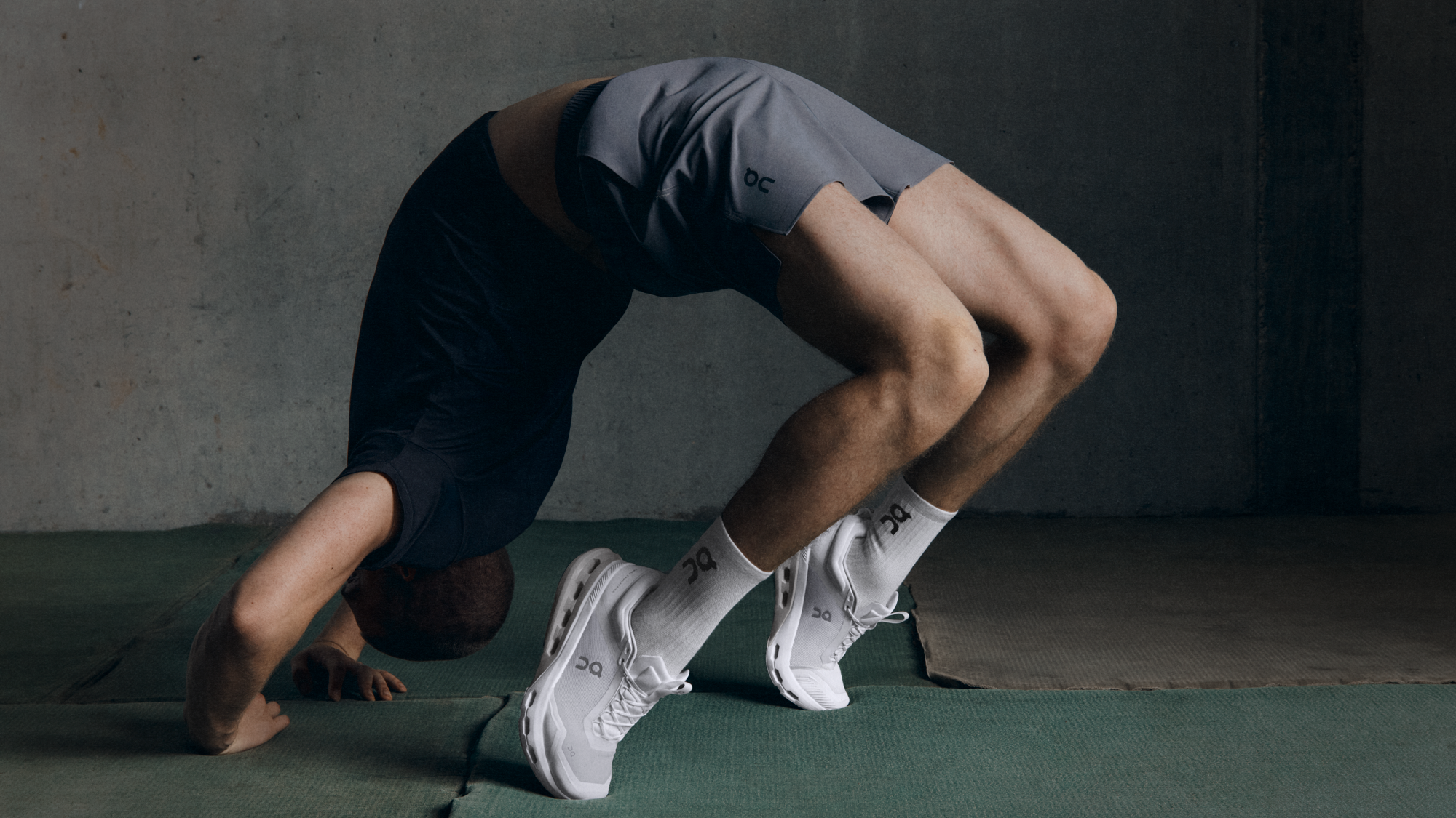 A man practices the upward bow pose.