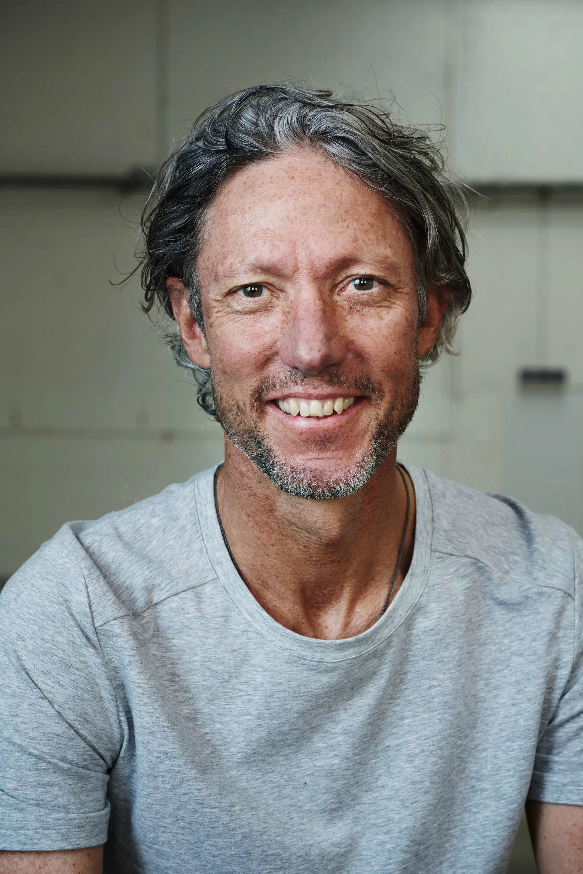 Portrait of On Co-Founder Olivier Bernhard in a gray t-shirt.