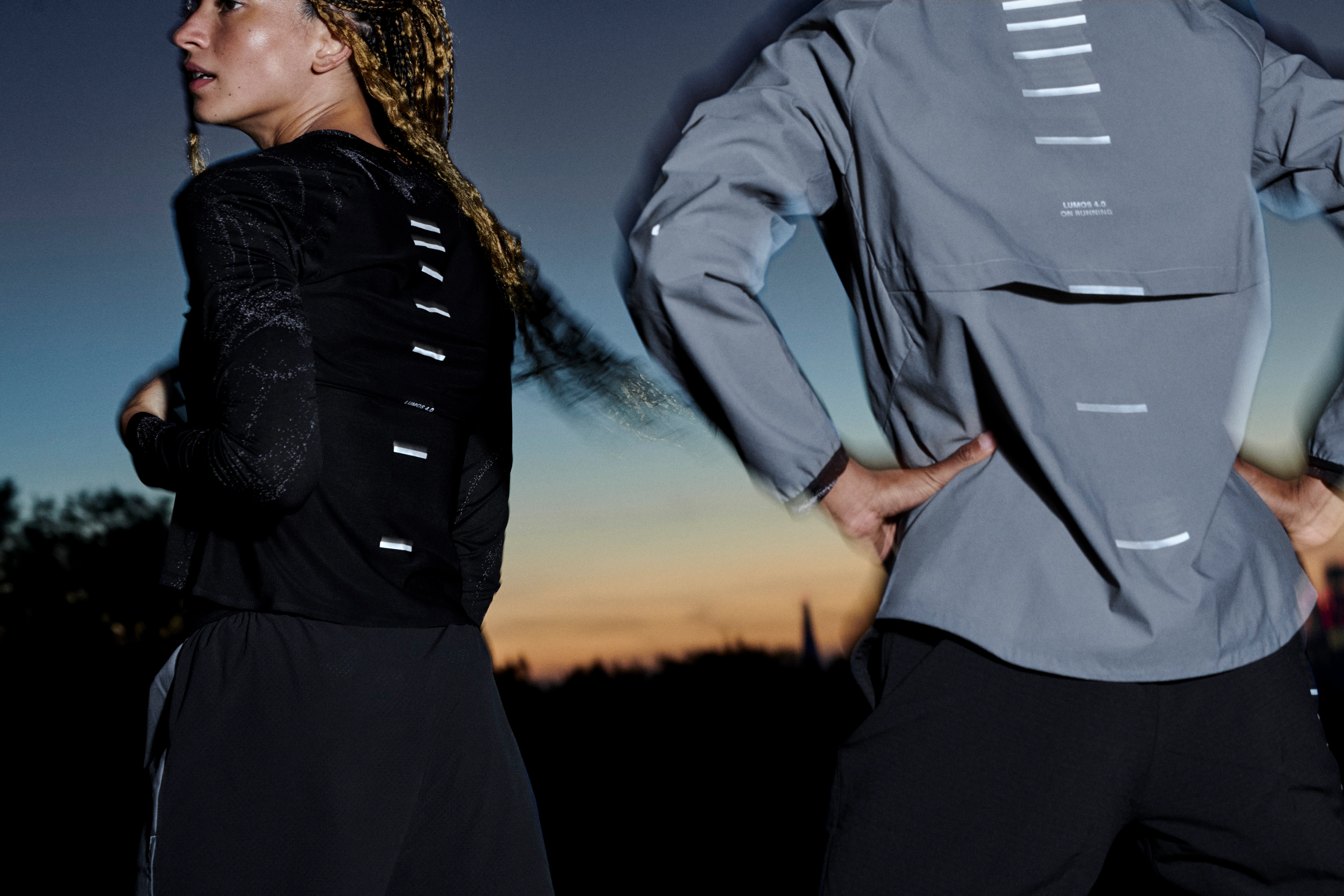A woman standing outside showing her On apparel from behind.