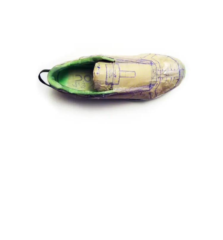 Prototype shoe with ink drawings all over it.
