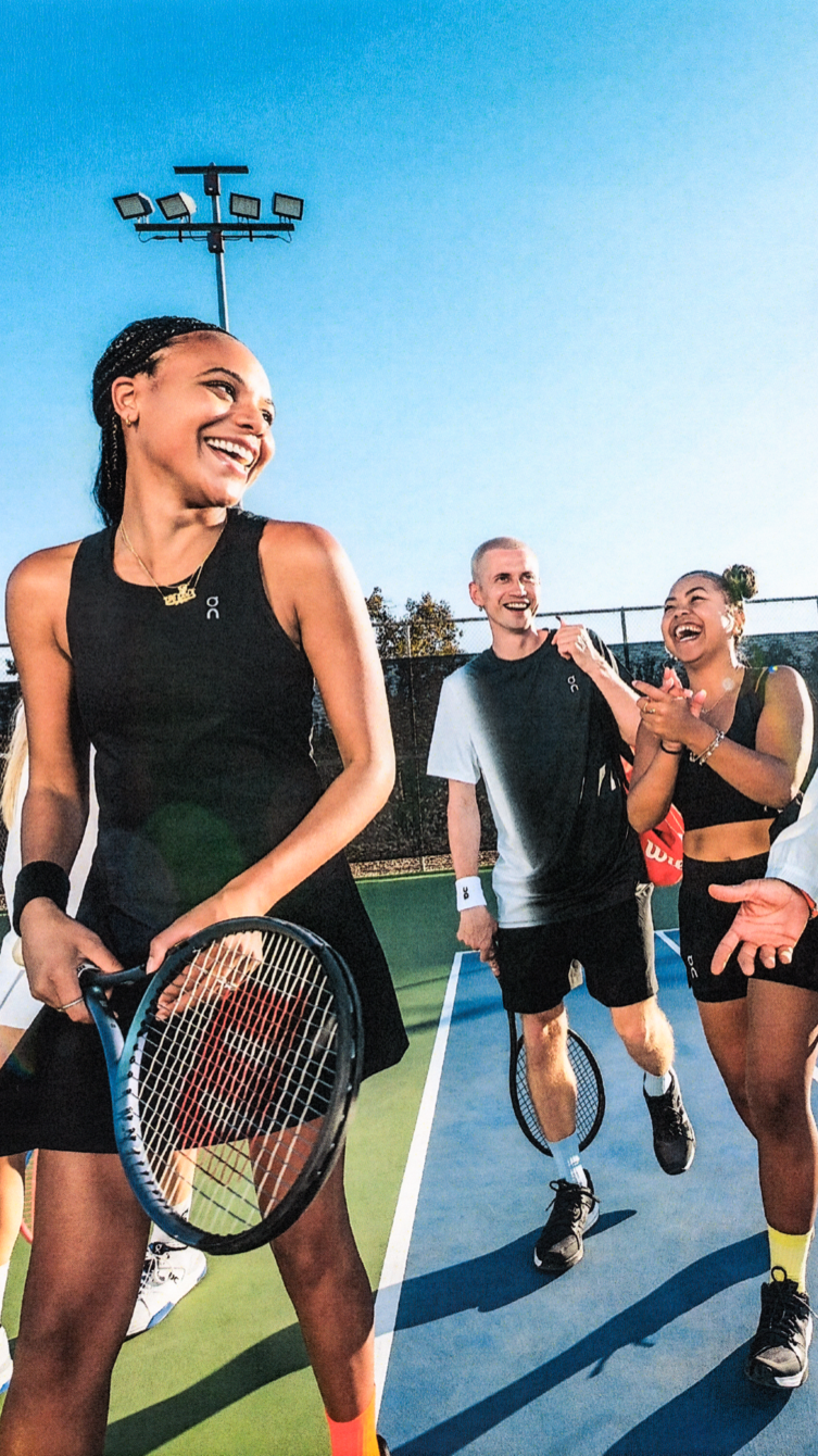 Friends leave the tennis court to refuel after a match.