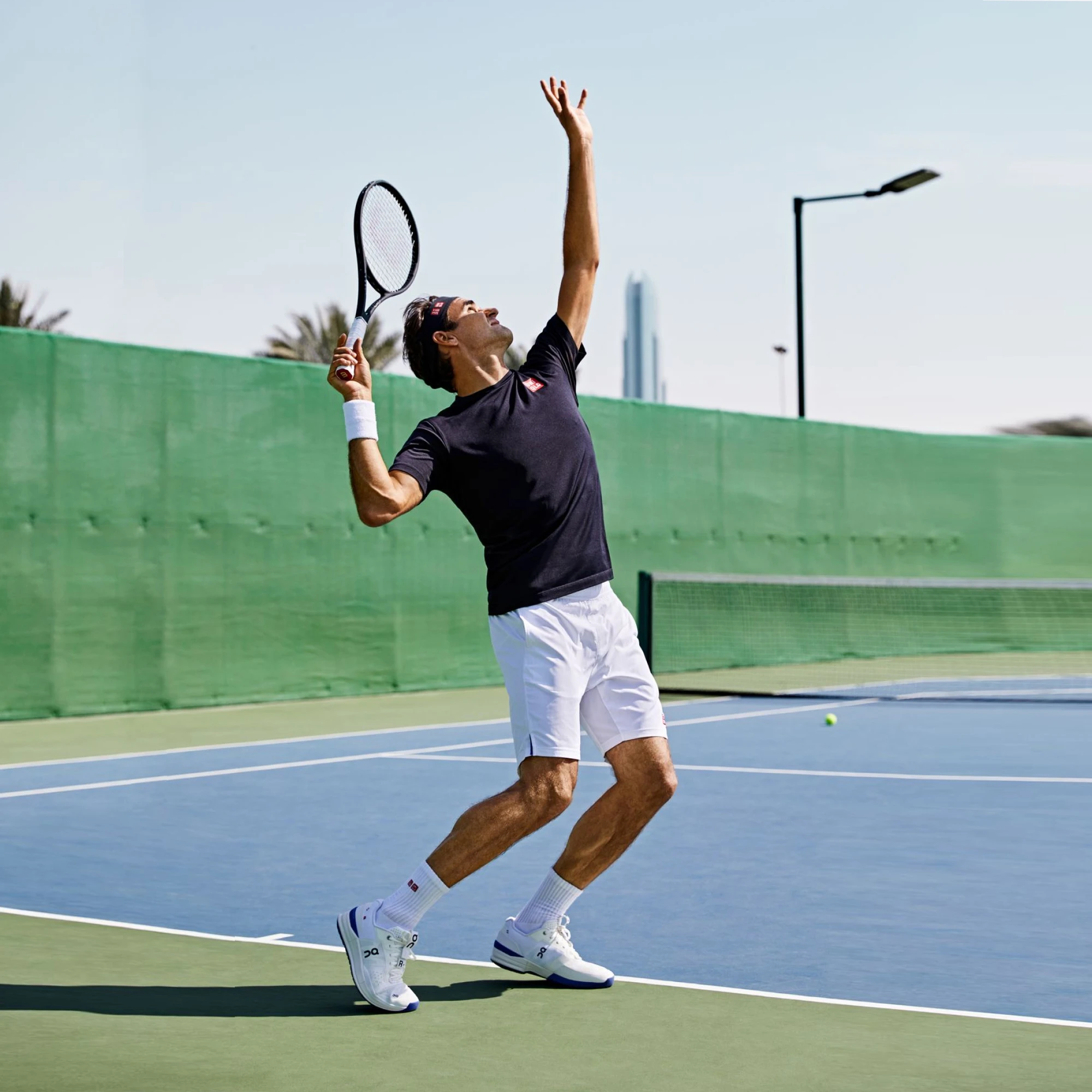 Roger Federer serving the ball in THE ROGER PRO on a hard court. 