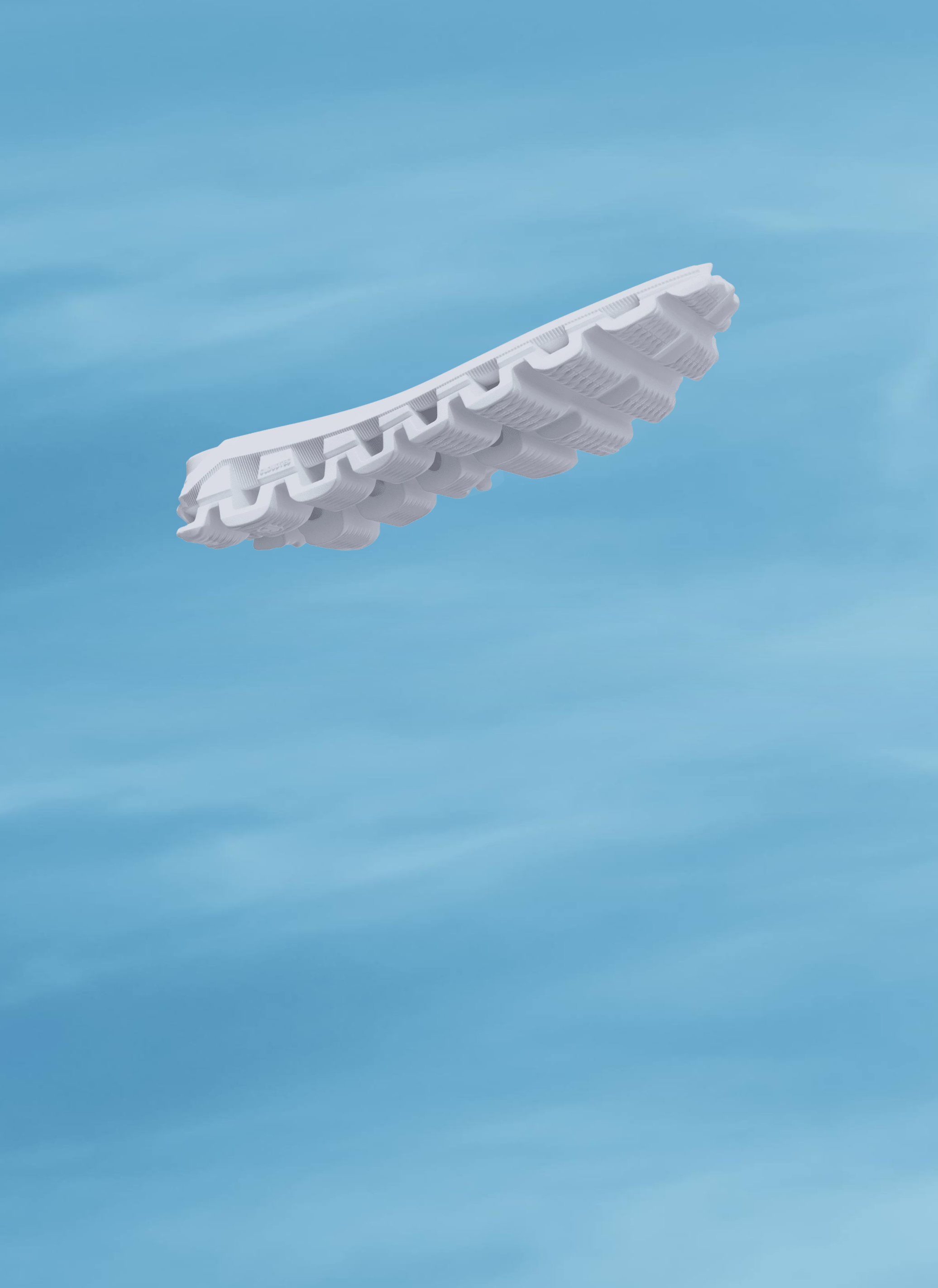 A CloudTec midsole floating in blue sky with light, scattered clouds.