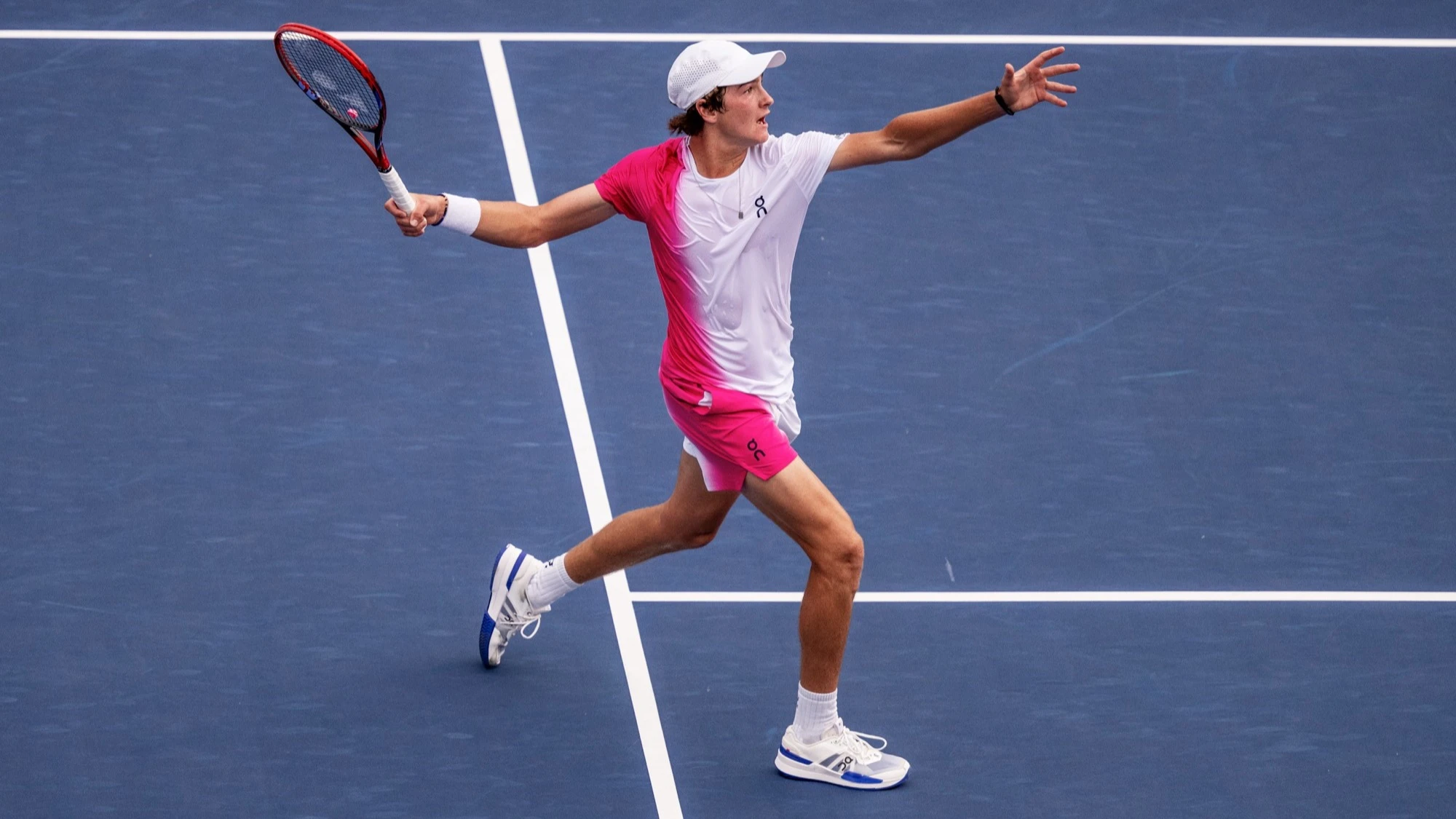 Joao Fonseca initiates the backswing of his tennis forehand. 