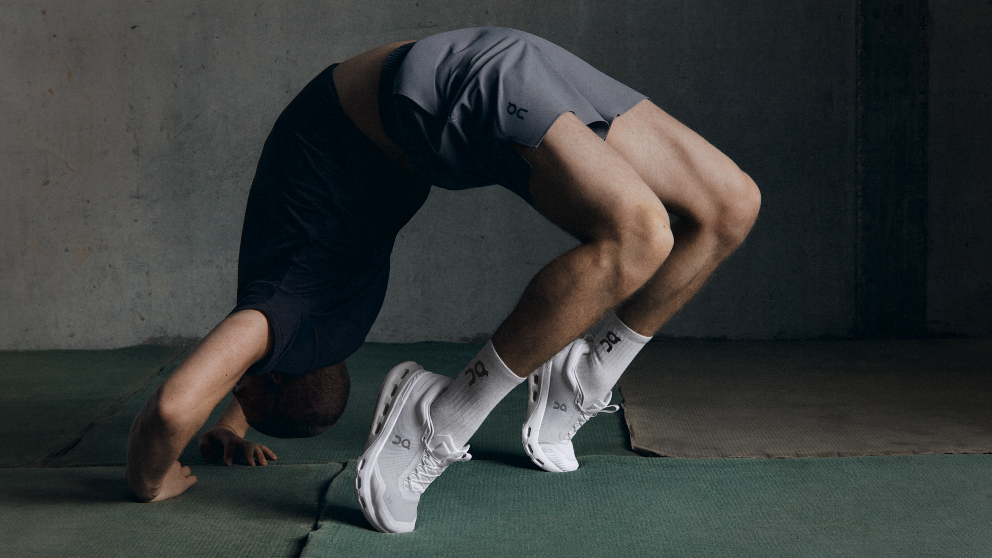 A man practices the upward bow pose.